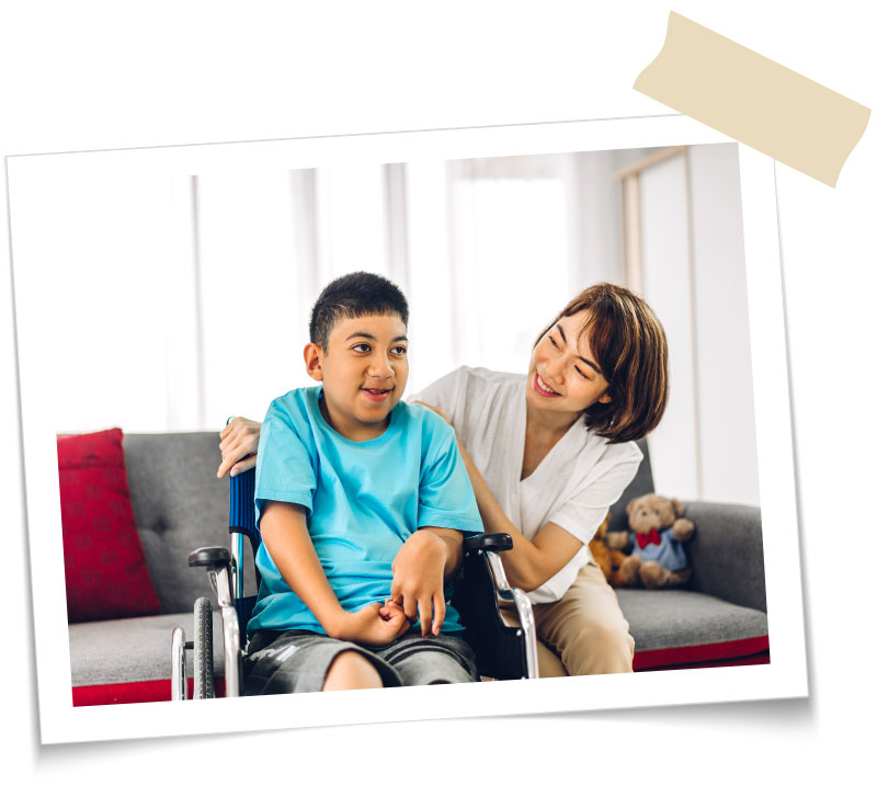mother with son sitting in wheelchair