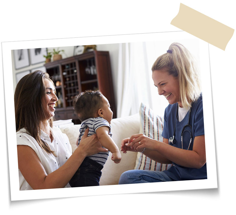 nurse with a young mom and infant son