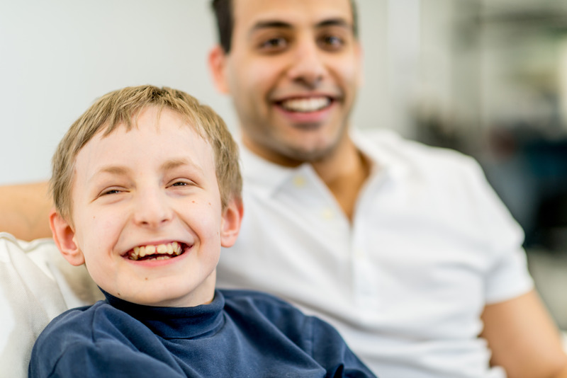 A child with special needs with a volunteer