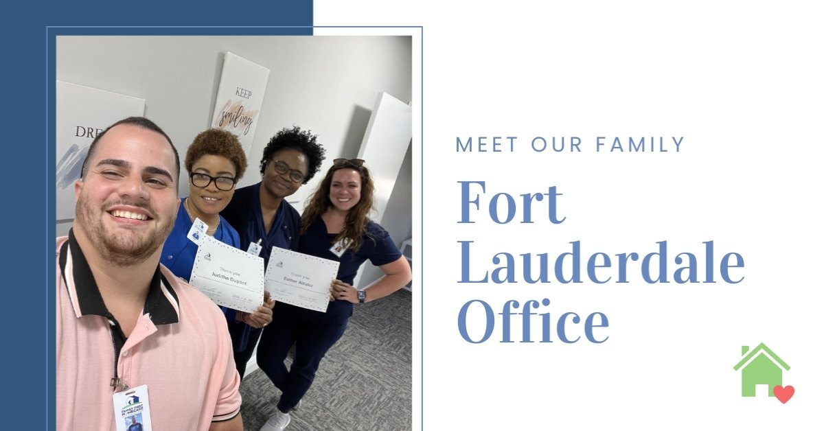 Four employees pose for a picture, two are holding thank you certificates