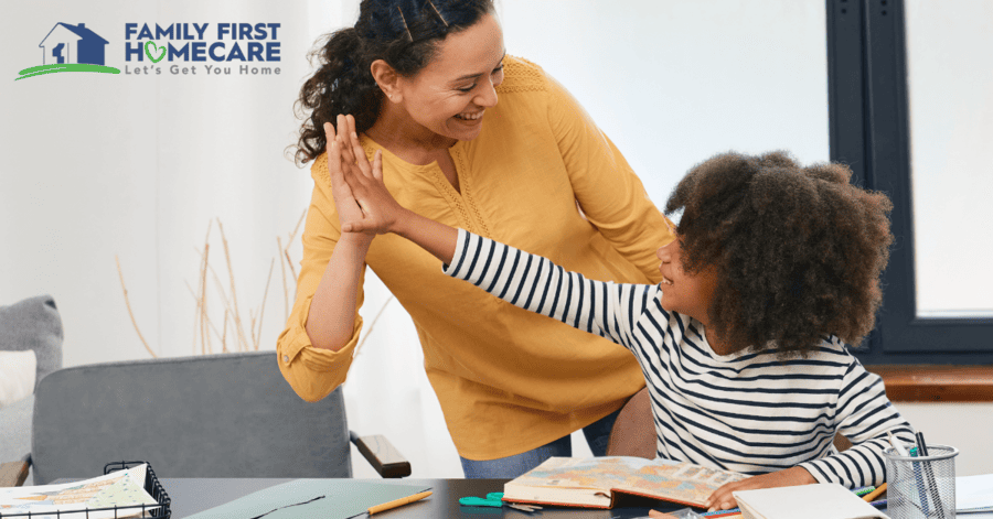 Woman in yellow high fives a child in stripes who is reading